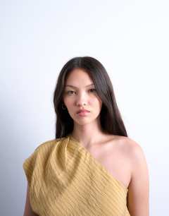 Model wearing One shoulder top in tan stripe