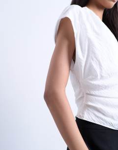 Model wearing One shoulder top in white