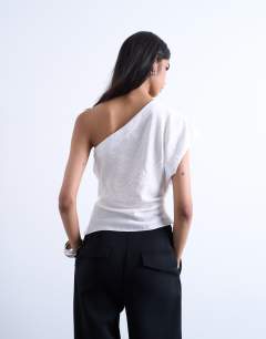 Model wearing One shoulder top in white