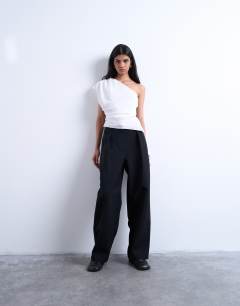Model wearing One shoulder top in white