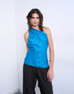 Model wearing One shoulder top with drape back in blue