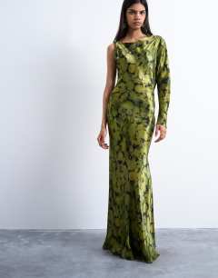 Model wearing One sleeve twist strap satin maxi dress in green floral
