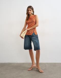 Model wearing Onion mesh button detail slash neck top in orange