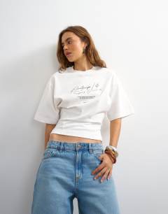 Model wearing Open archive graphic structured waist tee in white