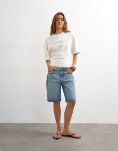 Model wearing Open archive graphic structured waist tee in white