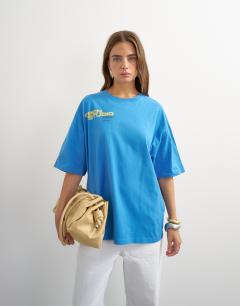 Model wearing Topshop 'Open Studio' oversized graphic t-shirt in blue