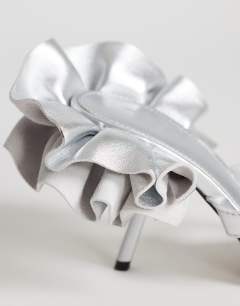 Model wearing Ophelia real leather high heeled sandal with ruffle in silver