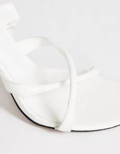 Model wearing Ophelia real leather high heeled sandal with ruffle in white