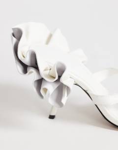Model wearing Ophelia real leather high heeled sandal with ruffle in white