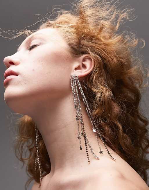 Topshop - Orecchini pendenti color oro con stelle e nappe