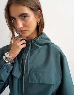 Model wearing Organza bomber in teal