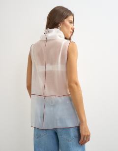 Model wearing Organza collapsed funnel neck top in white with contrast binding