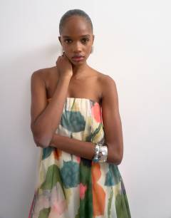 Model wearing Organza layered bandeau maxi dress in blurred floral print