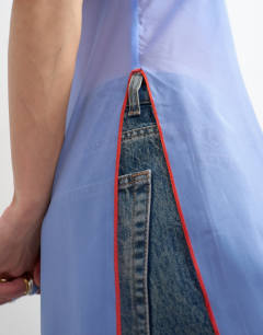 Model wearing Organza longline cami in blue with contrast orange tipping