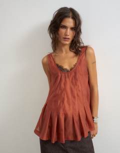 Model wearing Organza sheer sleeveless pintuck cami in rust