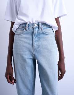Model wearing Original Mom high rise jean in bleach