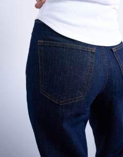 Model wearing Original Mom high rise jean in indigo rinse