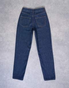 Model wearing Original Mom high rise jean in indigo rinse