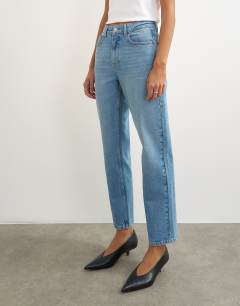 Model wearing Orson comfort stretch straight leg ankle grazer jean in bleach