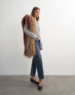 Model wearing Orson comfort stretch straight leg ankle grazer jean in blue black