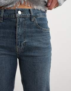 Model wearing Orson comfort stretch straight leg ankle grazer jean in blue black