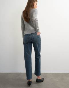 Model wearing Orson comfort stretch straight leg ankle grazer jean in blue black