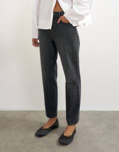 Model wearing Orson comfort stretch straight leg ankle grazer jean in washed black