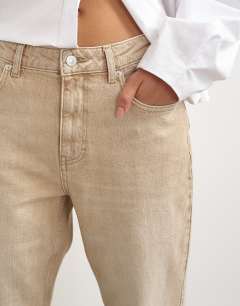 Model wearing Orson comfort stretch straight leg ankle grazer jean in winter oat