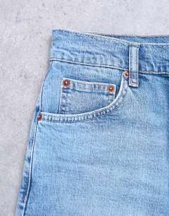 Model wearing Orson mid rise comfort straight jean in bleach