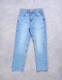Model wearing Orson mid rise comfort straight jean in bleach