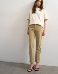 Model wearing Orson mid rise comfort straight jean in dark beige
