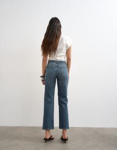 Model wearing Orson mid rise comfort straight jean in deep blue