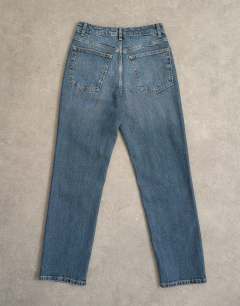 Model wearing Orson mid rise comfort straight jean in deep blue