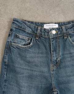 Model wearing Orson mid rise comfort straight jean in deep blue