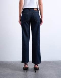 Model wearing Orson mid rise comfort straight jean in indigo rinse