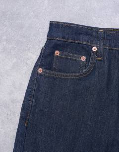 Model wearing Orson mid rise comfort straight jean in indigo rinse