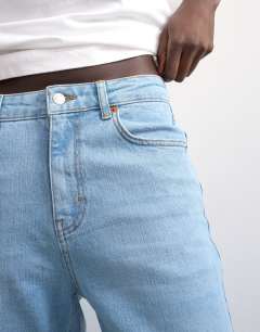 Model wearing Orson mid rise comfort straight jean in light bleach