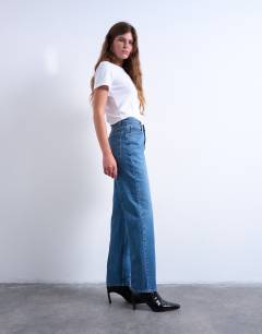 Model wearing Orson mid rise comfort straight jean in mid blue