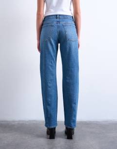 Model wearing Orson mid rise comfort straight jean in mid blue