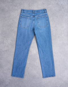 Model wearing Orson mid rise comfort straight jean in mid blue