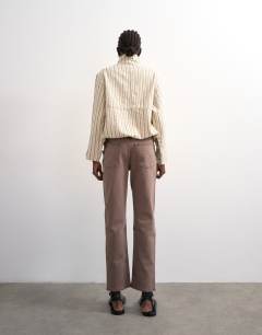 Model wearing Orson mid rise comfort straight jean in otter