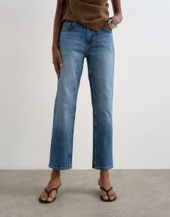 Model wearing Orson mid rise comfort straight jean in vintage blue