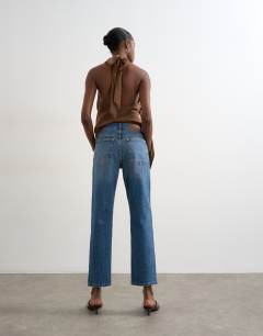 Model wearing Orson mid rise comfort straight jean in vintage blue