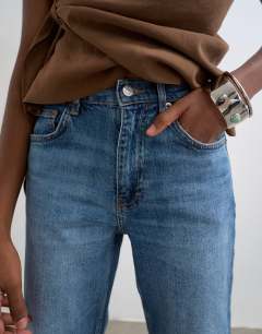 Model wearing Orson mid rise comfort straight jean in vintage blue