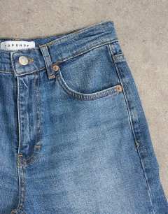 Model wearing Orson mid rise comfort straight jean in vintage blue