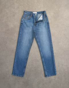 Model wearing Orson mid rise comfort straight jean in vintage blue