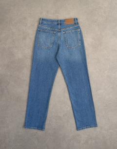 Model wearing Orson mid rise comfort straight jean in vintage blue