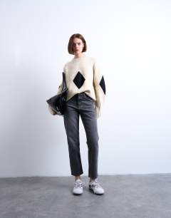 Model wearing Orson mid rise comfort straight jean in washed black