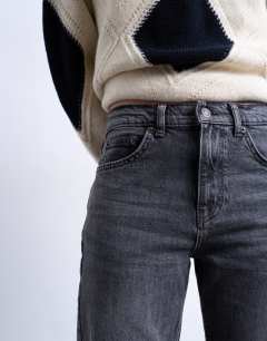 Model wearing Orson mid rise comfort straight jean in washed black