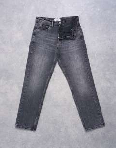 Model wearing Orson mid rise comfort straight jean in washed black